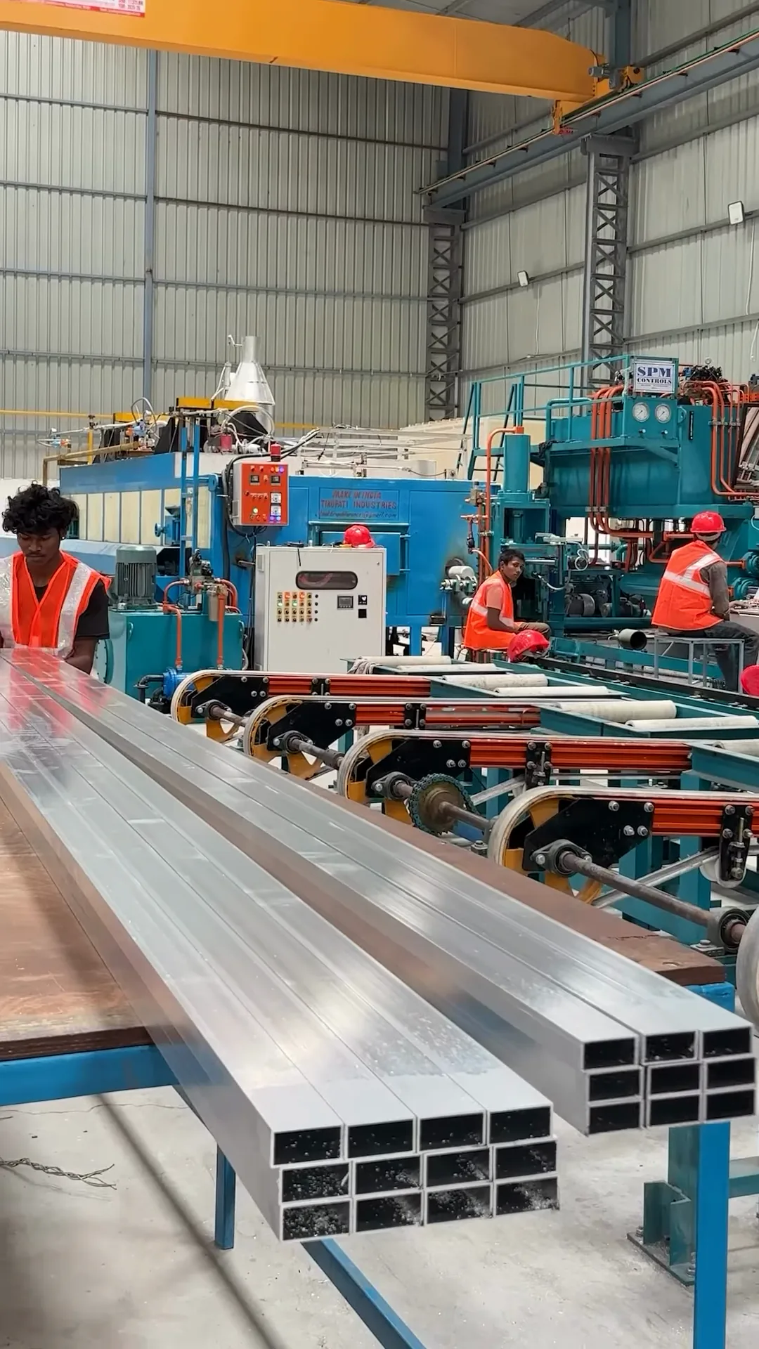 Freshly extruded square sections on the run-out table